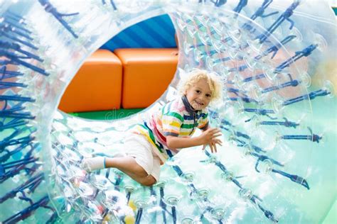 Child Play In Roller Wheel Kids On Trampoline Stock Image Image Of