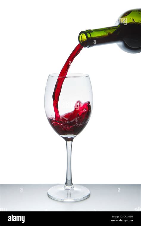 Red Wine Pouring Into Wine Glass Isolated Stock Photo Alamy