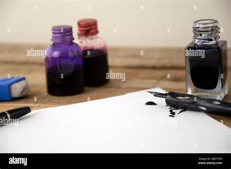 Ink and artists pen with white art paper Stock Photo - Alamy