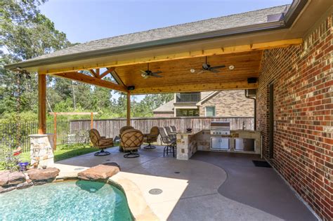 Majestic Patio Cover And Outdoor Kitchen With Peninsula Rustic