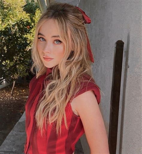 Sabrina Carpenter Hair Curtain Bangs And Red Outfit