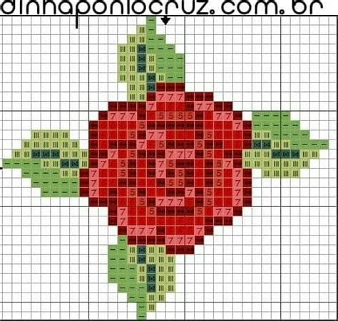 A Cross Stitch Pattern With A Red Flower On It