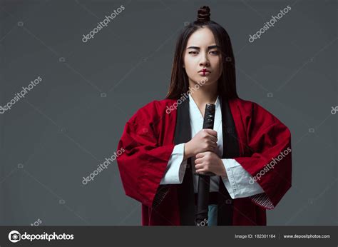 Asian Woman Kimono Holding Katana Sword Looking Camera Isolated Grey