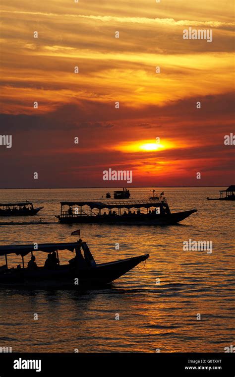 Sunset Over Boats On Tonle Sap Lake At Chong Khneas Floating Village