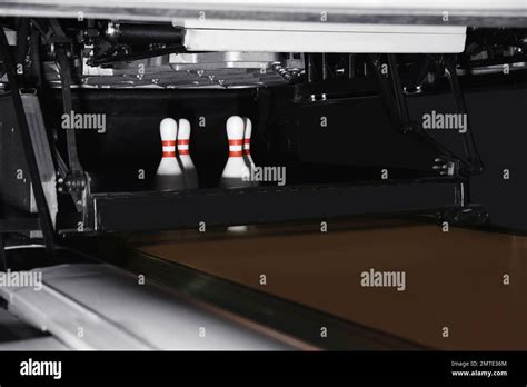 Automatic pin setting machine in bowling club Stock Photo - Alamy