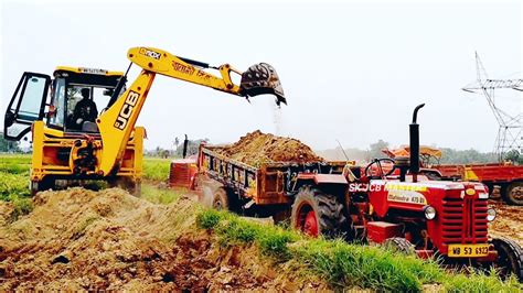 Jcb 3dx Backhoe Machine Working With Two Mahindra Tractor For Making