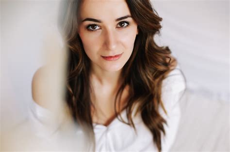 Premium Photo Beautiful Brunette In The Bedroom