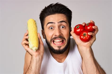 Premium Photo Midsection Of Woman Holding Tomatoes