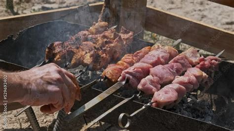 Grilling Shashlik On Barbecue Grill Outdoors Process Of Cooking