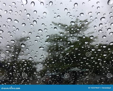 The Raindrops On The Windscreen Or Windshield Or Car Glass View From