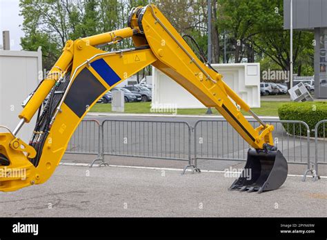 Long Arm Backhoe Loader Machine At Street Construction Site Stock Photo