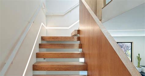 These Wood Stairs Have A Strip Of Lighting Built Into The Wall