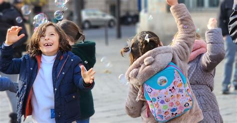 Kids Playing with Soap Bubbles · Free Stock Photo