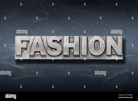 Fashion Word Made From Metallic Letterpress On Dark Jeans Background