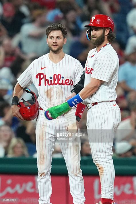 Trea Turner And Bryce Harper Of The Philadelphia Phillies Look On