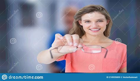 Composition Of Woman Holding Reading Glasses On Blurred Medical Background Stock Image Image