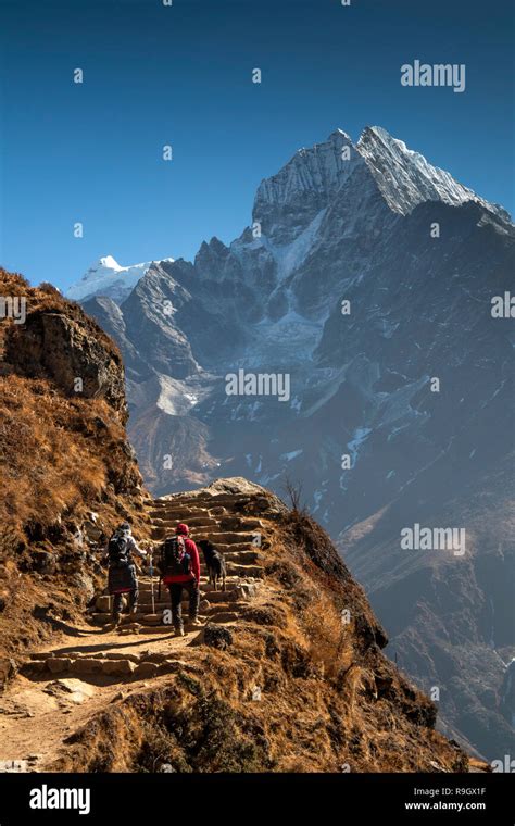 Nepal Everest Base Camp Trek Trekkers Climbing Stone Steps In View Of