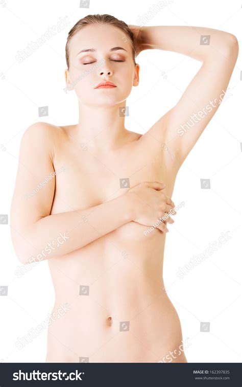 Стоковая фотография 162397835 Attractive Naked Woman Holding Her