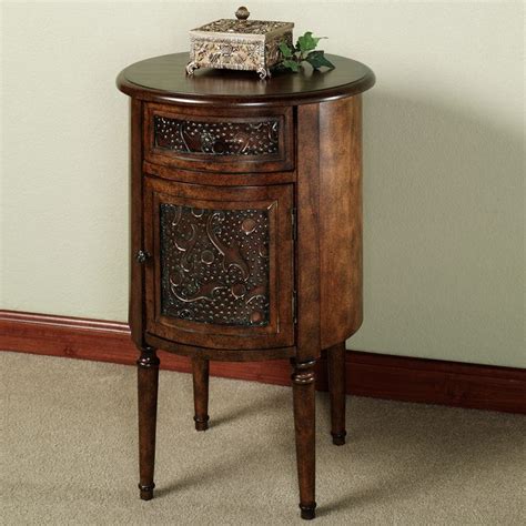 A Small Wooden Cabinet Sitting On Top Of A Carpeted Floor Next To A Wall