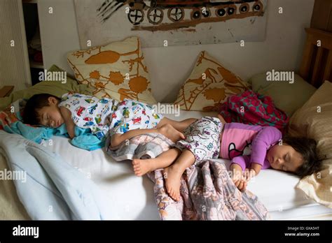 Little girl and boy sleeping Stock Photo - Alamy