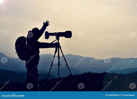 Professional Photographer Silhouette And Photo Shoot Work Stock Photo