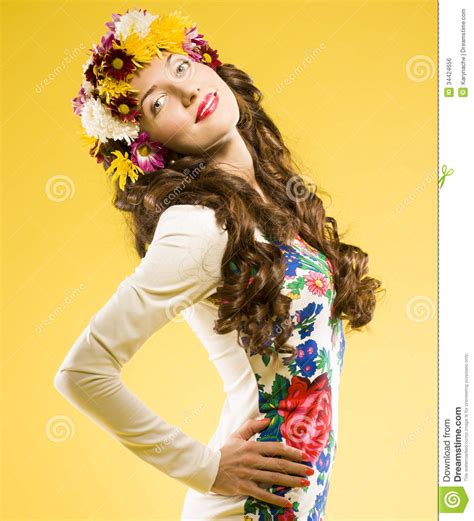 Pretty Brunette With Curly Hair Studio Yellow Background Stock Photo