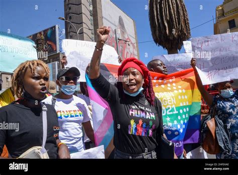 Demonstrators hold placards and chant slogans during the protest in