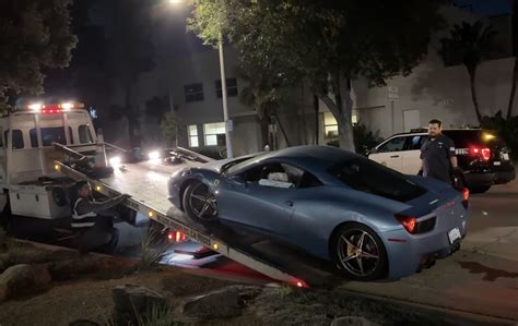 Getting A Crashed Ferrari Up On A Flatbed Truck Is An Owners Worst