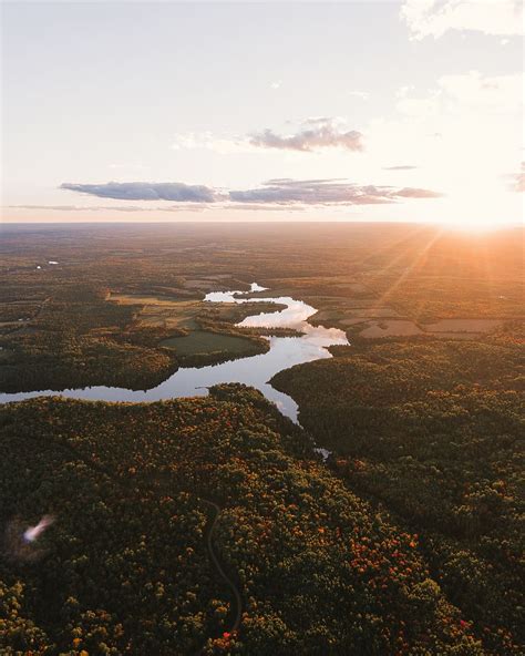 HD Wallpaper Aerial Photography Of River Between Trees Sunset Drone