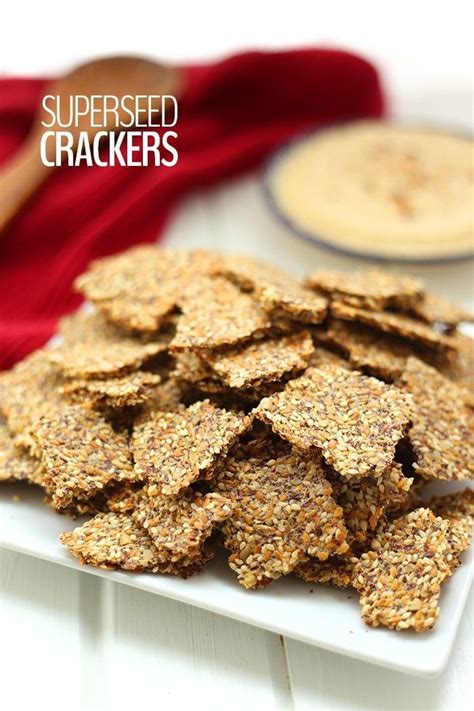 A White Plate Topped With Crackers On Top Of A Table