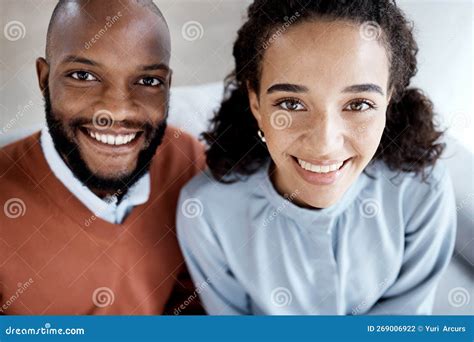 Happy Smile And Portrait Of An Interracial Couple On The Sofa For Happiness Relax And Together