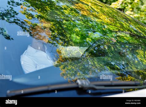 Beautiful Smiling Brunette Girl Behind The Wheel Of A Car Stock Photo Alamy