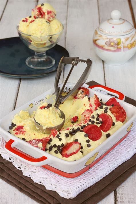 An Ice Cream Dish With Strawberries And Chocolate Chips