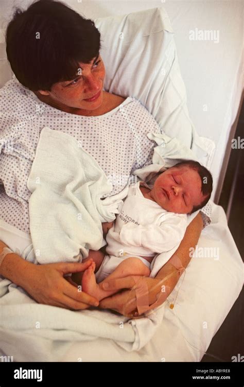 New Born Baby In Arms Of Mother Stock Photo Alamy