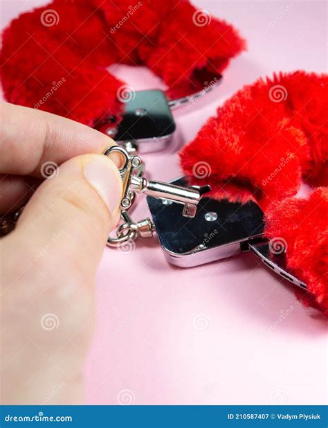 Red Fluffy Handcuffs With Keys On A Pink Background Stock Image Image