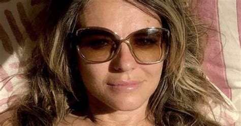 Liz Hurley Whips Off Bikini Top For Sizzling Sunbathing Session Daily Star