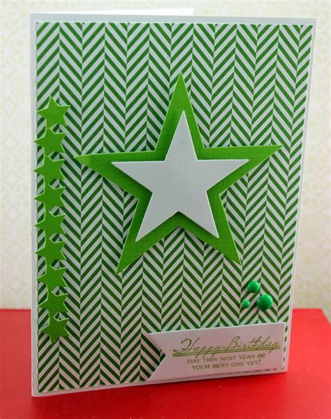 A Green And White Card With A Star On It