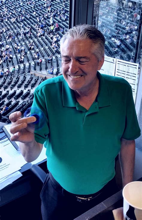 Pat Hughes with his new Cubs fidget spinner. : CHICubs