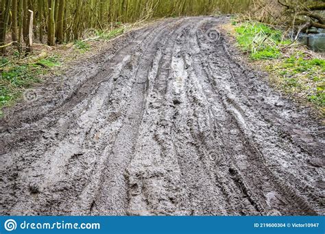 Muddy Trail with Tire Tracks Next To River Cole in England Stock Photo ...