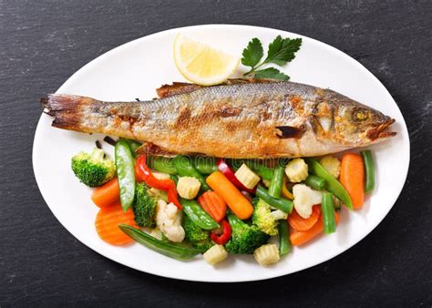 Plate Of Baked Fish With Vegetables Stock Image Image Of Grilled