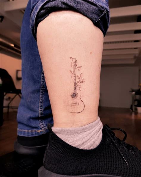 11+ Simple Guitar Tattoo Designs That Will Blow Your Mind!