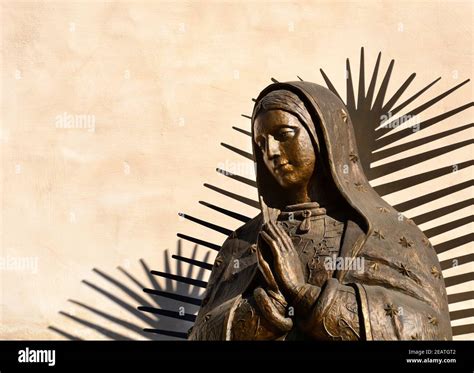 A Bronze Statue Of Our Lady Of Guadalupe Also Known Asthe Virgin Of Guadalupe Outside San