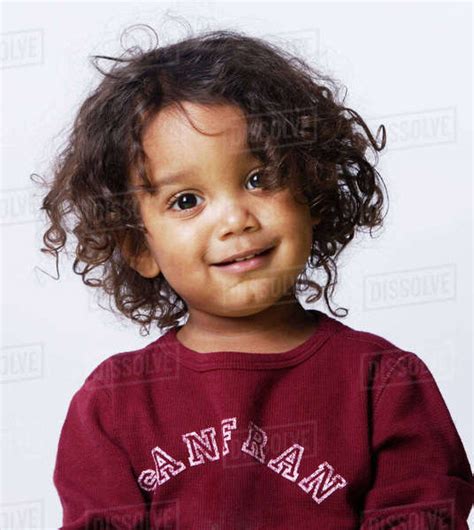 Mixed Race Boy With Curly Hair Stock Photo Dissolve