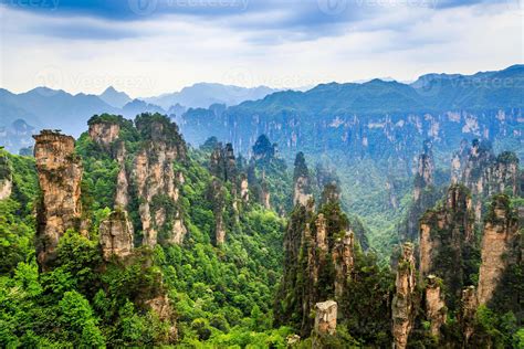 quartzite sandstone pillars  peaks  green trees  mountains
