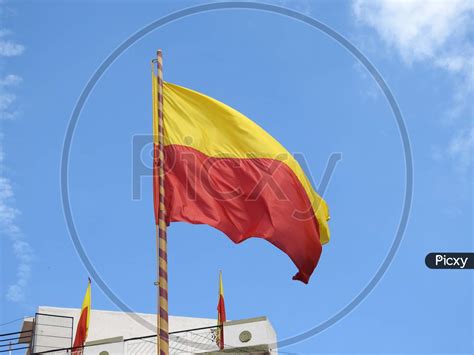 Image Of Beautiful Karnataka Yellow And Red Color Flag Waving Or Flying In A Sky Background