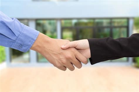 Premium Photo Cropped Image Of Business People Shaking Hands In Office