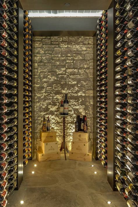 The Wine Cellar Is Filled With Many Bottles