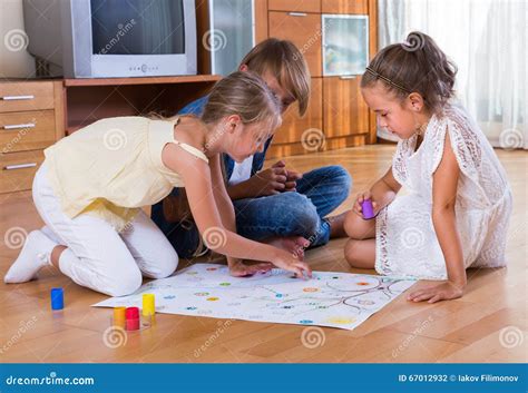 Kids Sitting On Floor With Game Stock Photo Image Of Caucasian