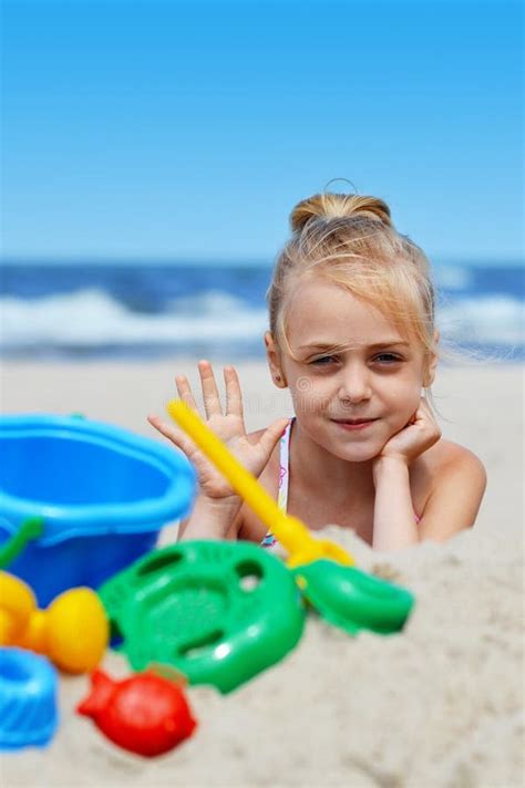 Little Girl Playing On The Sand Beach Stock Photo Image Of Watering