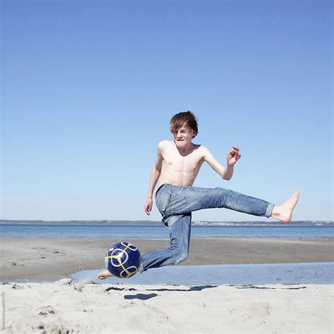 "Beach Soccer Boy" by Stocksy Contributor "Marcel" - Stocksy